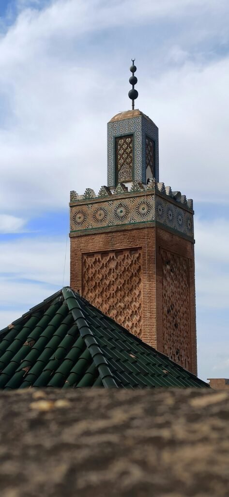 Explore the intricate architecture of a historic mosque's minaret in Tlemcen, Algeria.