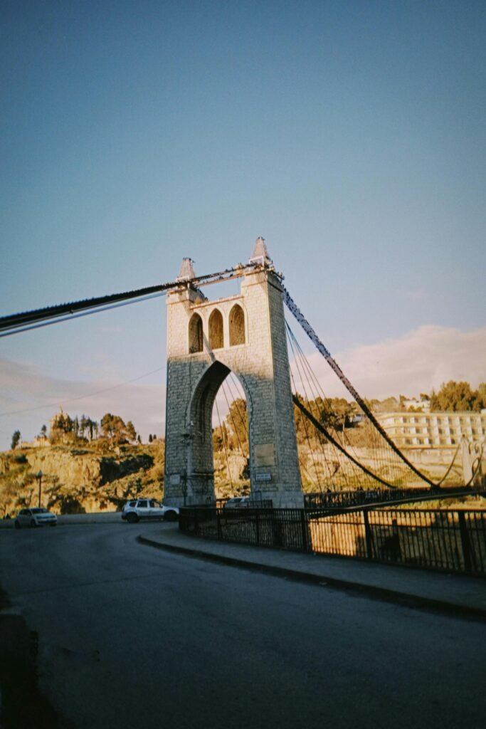 View of the iconic Sidi M'Cid suspension bridge in Constantine, Algeria during the day.