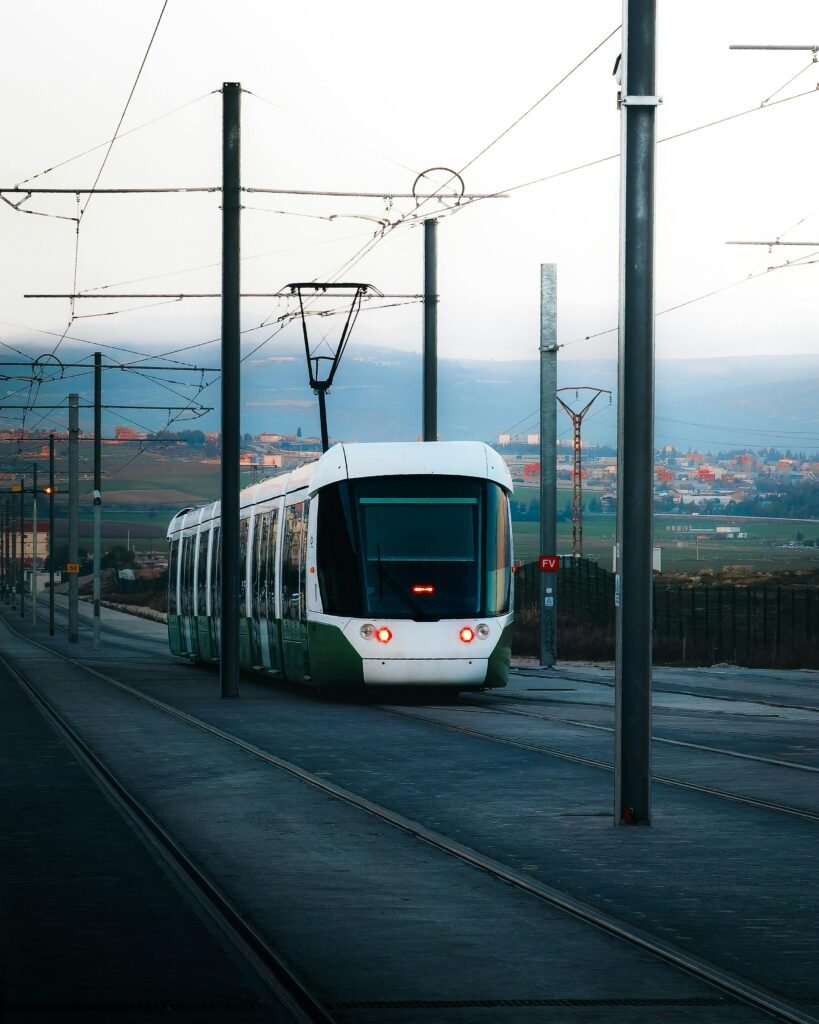 A contemporary tram traverses the tracks in Constantine, Algeria, showcasing urban transportation.