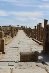 Explore the well-preserved ancient Roman city ruins in Timgad, Algeria.