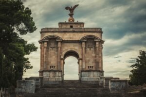 Majestic war memorial arch with eagle sculpture in Constantine, Algeria.