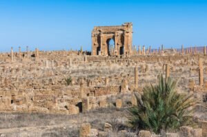 Explore the historical Roman ruins of Timgad with the iconic Arch of Trajan, Batna, Algeria.
