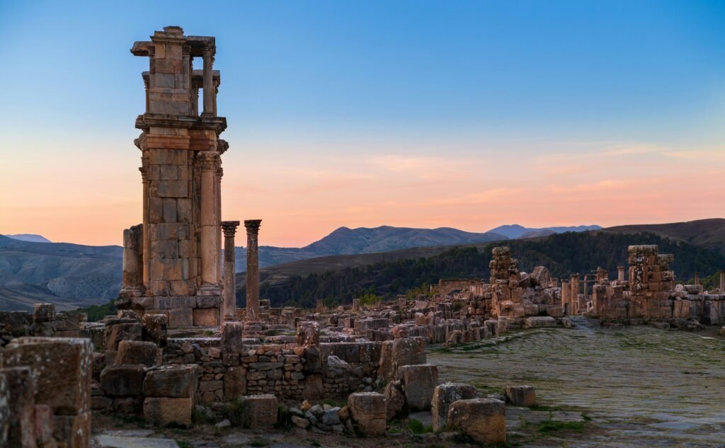 Explore the ancient Roman ruins in Sétif, Algeria, glowing in the serene sunrise.